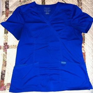 Cherokee Scrub Top, size M. Two front pockets with smaller ones inside.